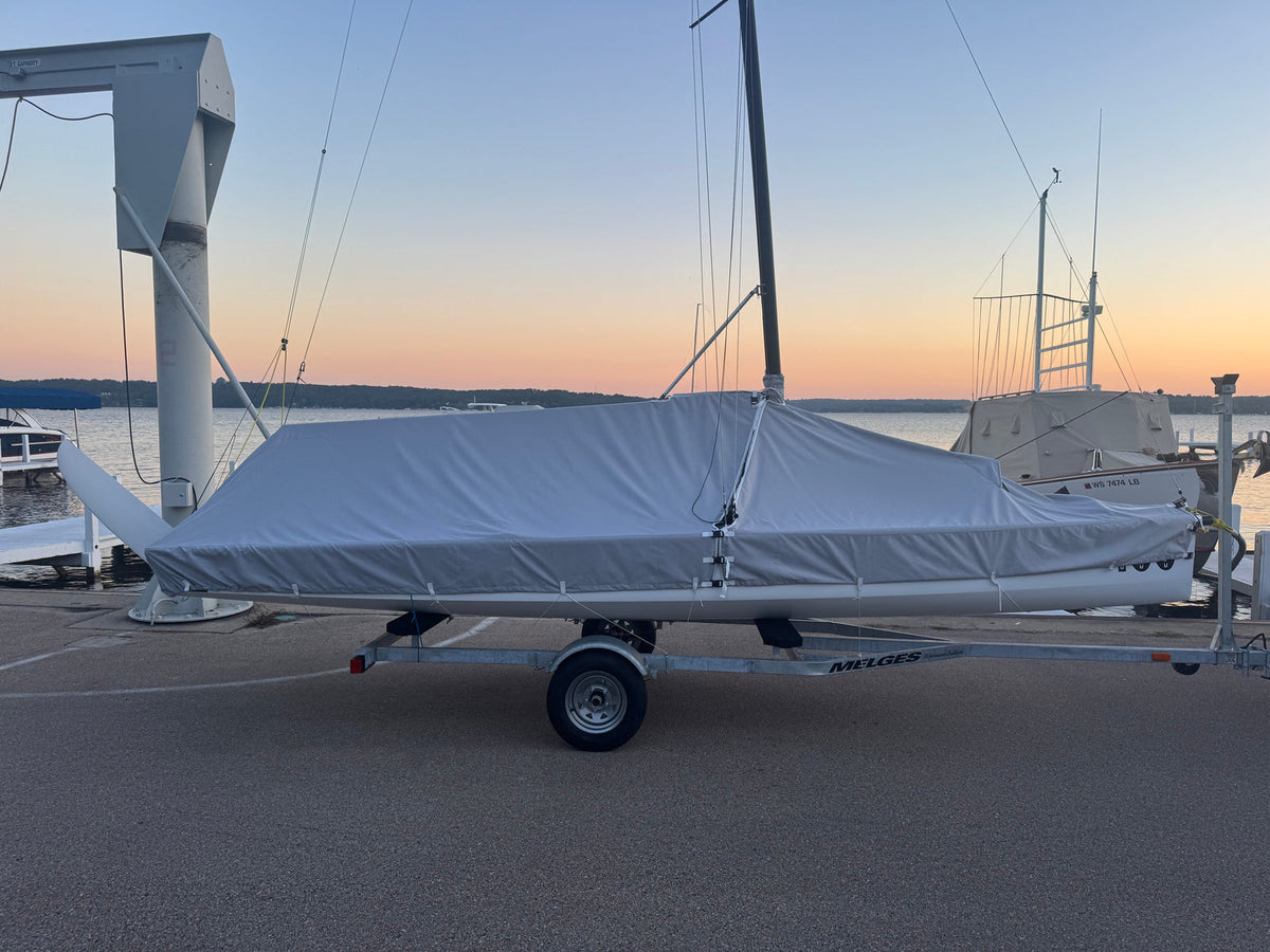 Melges 19 full deck cover fitted over the boom and deck. Boat, rig and trailer shown for context and not included.