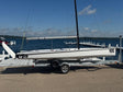 Official Melges 19 combi-trailer and detachable dolly, side view. Boat and rig shown for context and not included.