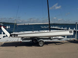 Official Melges 19 combi-trailer and detachable dolly, side view. Boat and rig shown for context and not included.
